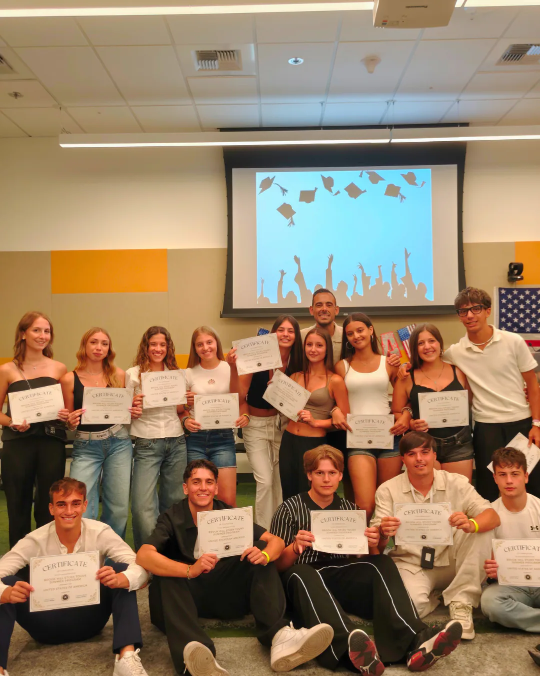 Students celebrating their summer course with certificates