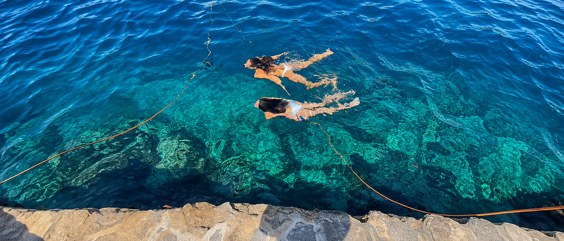Students swimming in the crystal-clear waters of Malta’s Blue Lagoon