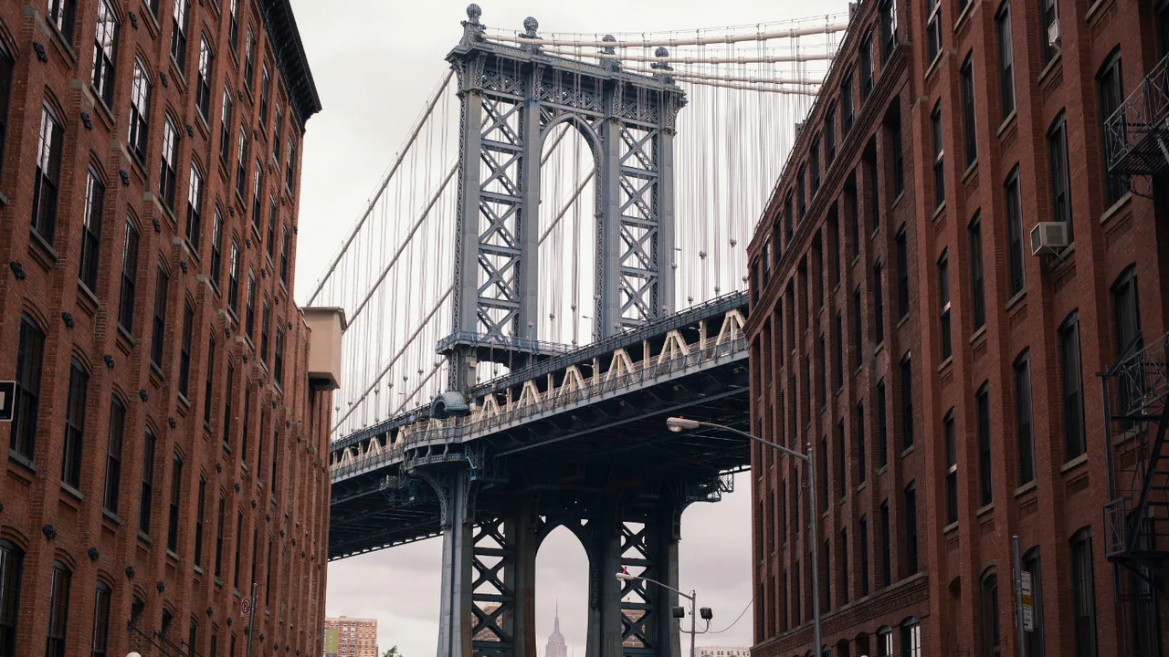 The Manhattan Bridge framed by buildings in DUMBO, Brooklyn