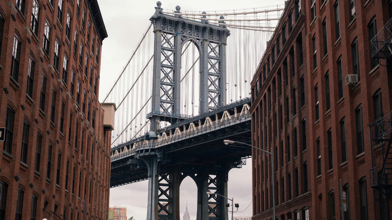 The Manhattan Bridge framed by buildings in DUMBO, Brooklyn