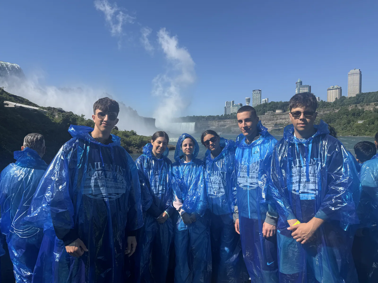 Students in blue rain ponchos at Niagara Falls
